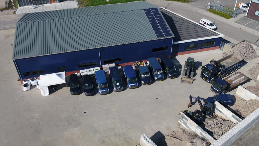Werkplaats en team van JD Infra